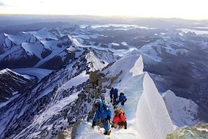 A team of climbers on a crisp morning near the summit of Mt Everest