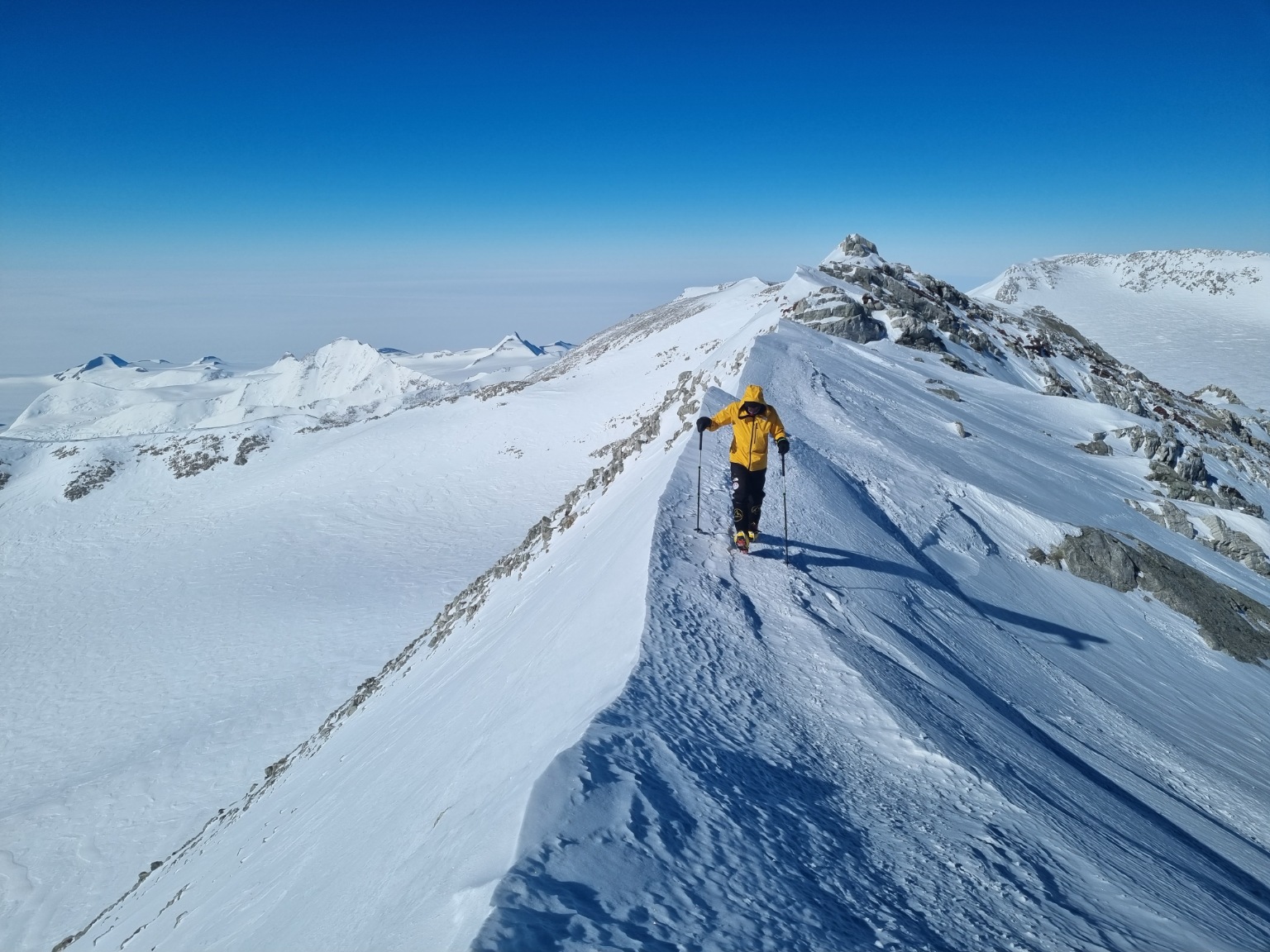 Client on a snowy ridge during a guided Vinson Massif Expedition