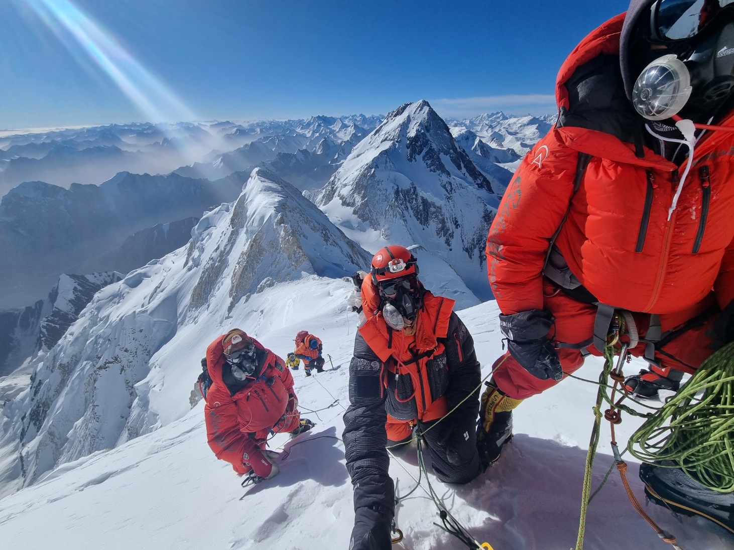 Three climbers nearing the summit of Gasherbrum II