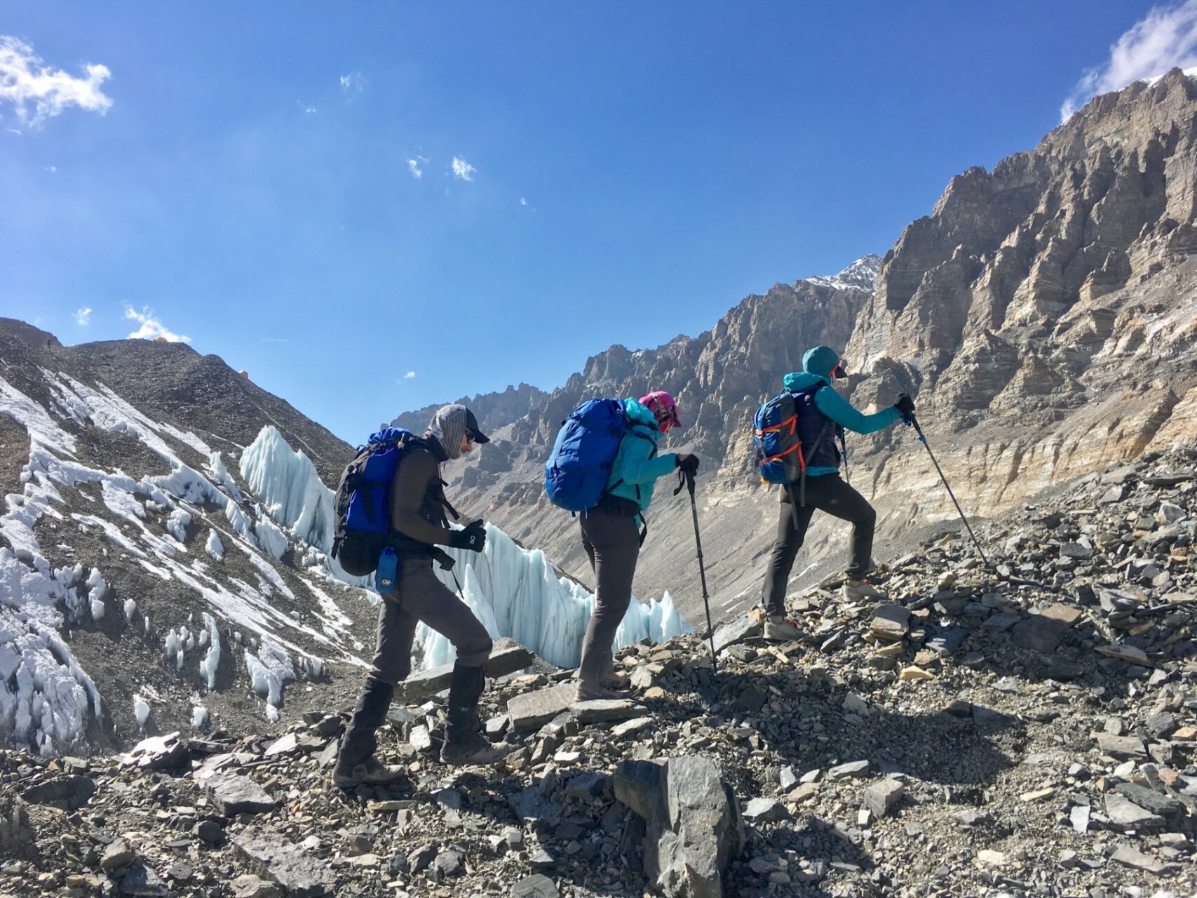 Three hikers passing by penitentes on the Everest Base Camp Trek