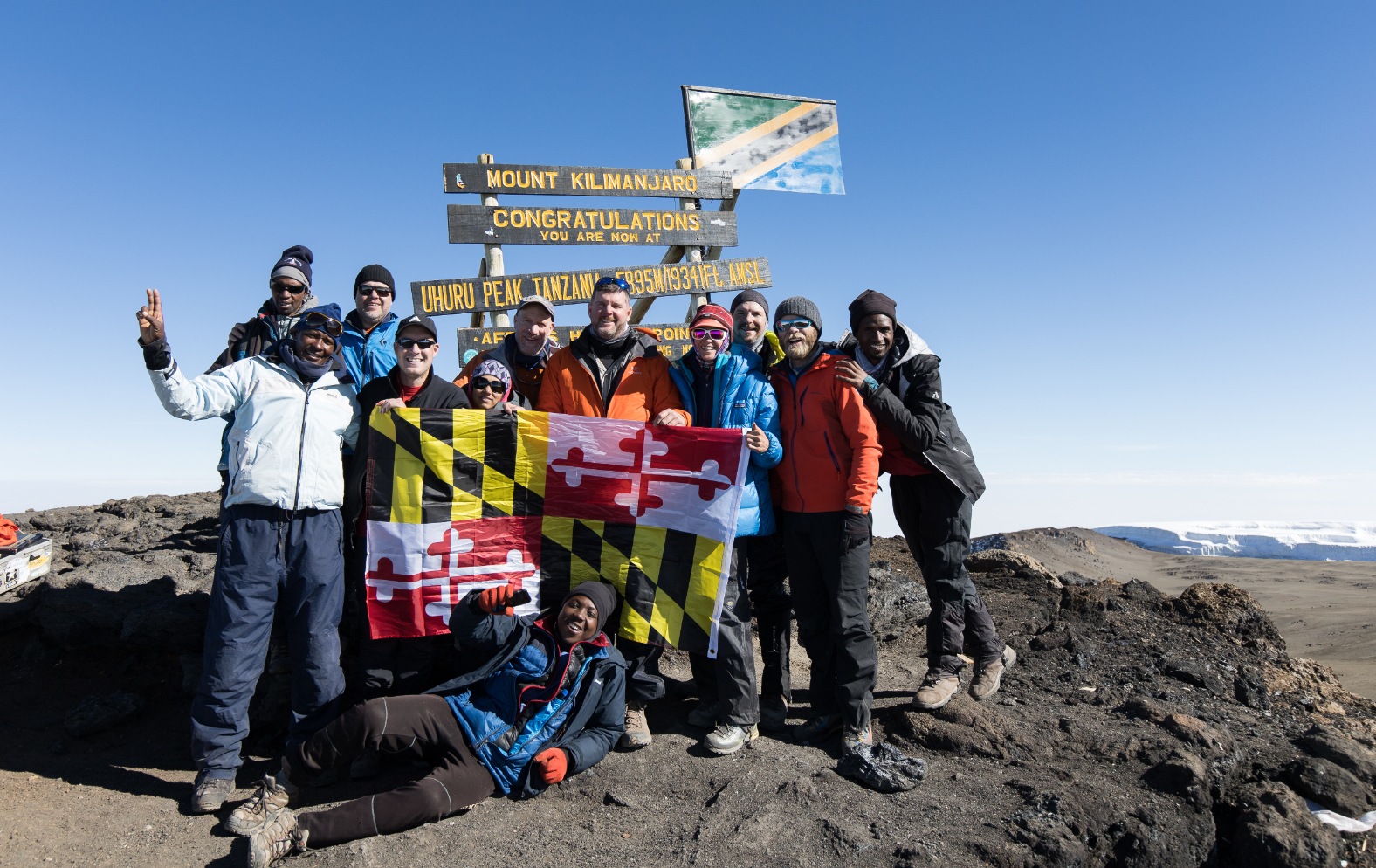 Clients on the summit of Kilimanjaro during a Kilimanjaro Expedition