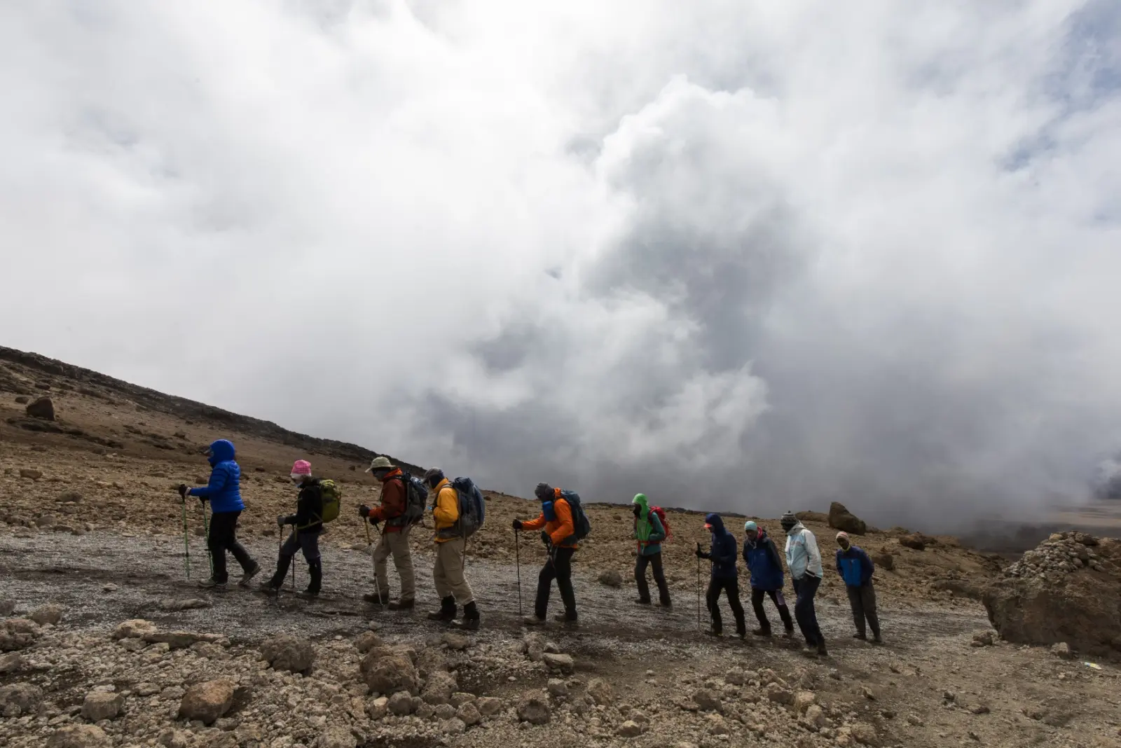 Clients hiking up Kilimanjaro during a guided Kilimanjaro Expedition with Alpenglow Expeditions.