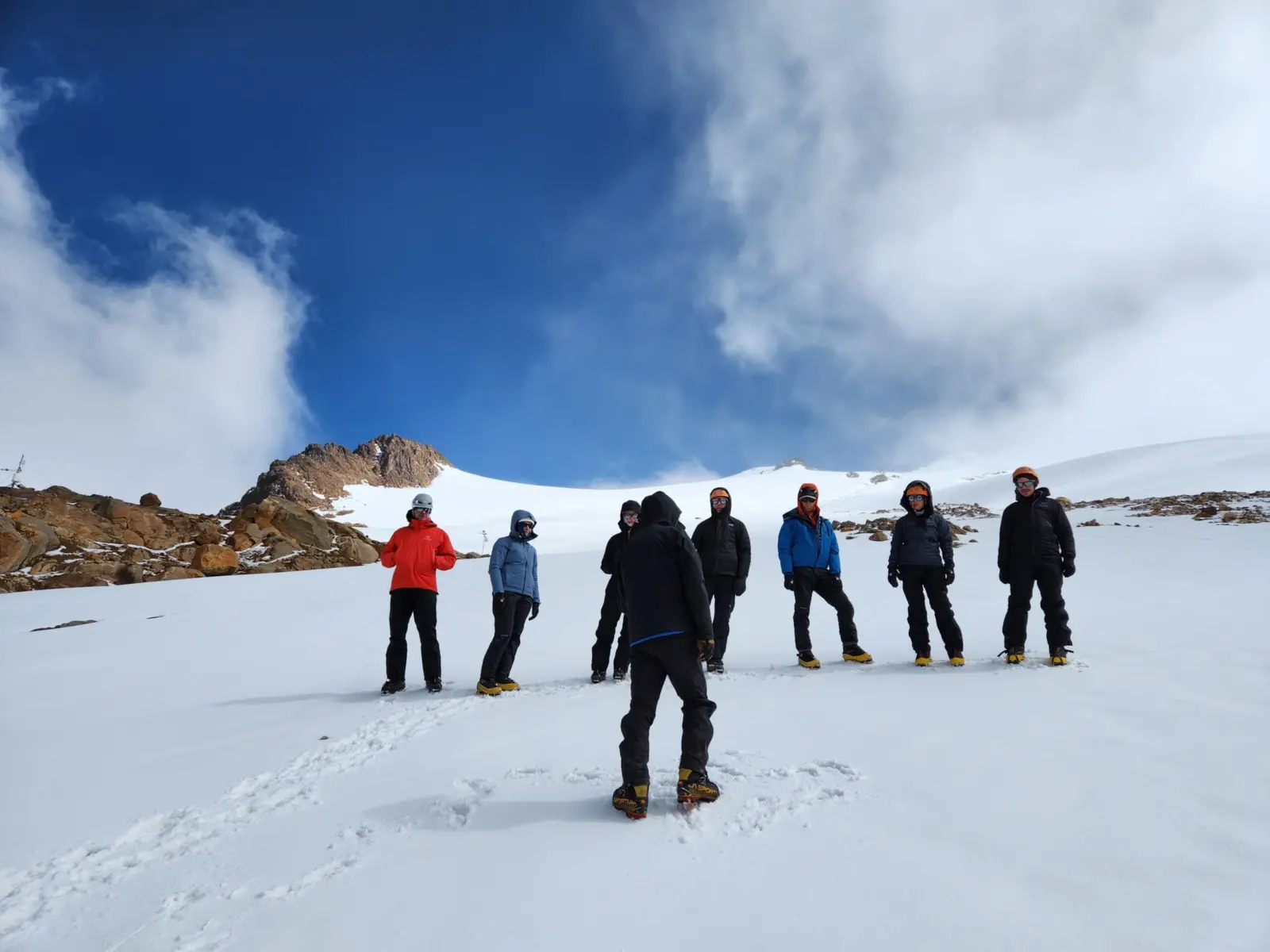 Intro to high-altitude mountaineering students learning glacier skills during Alpenglow Expeditions' Ecuador Climbing School