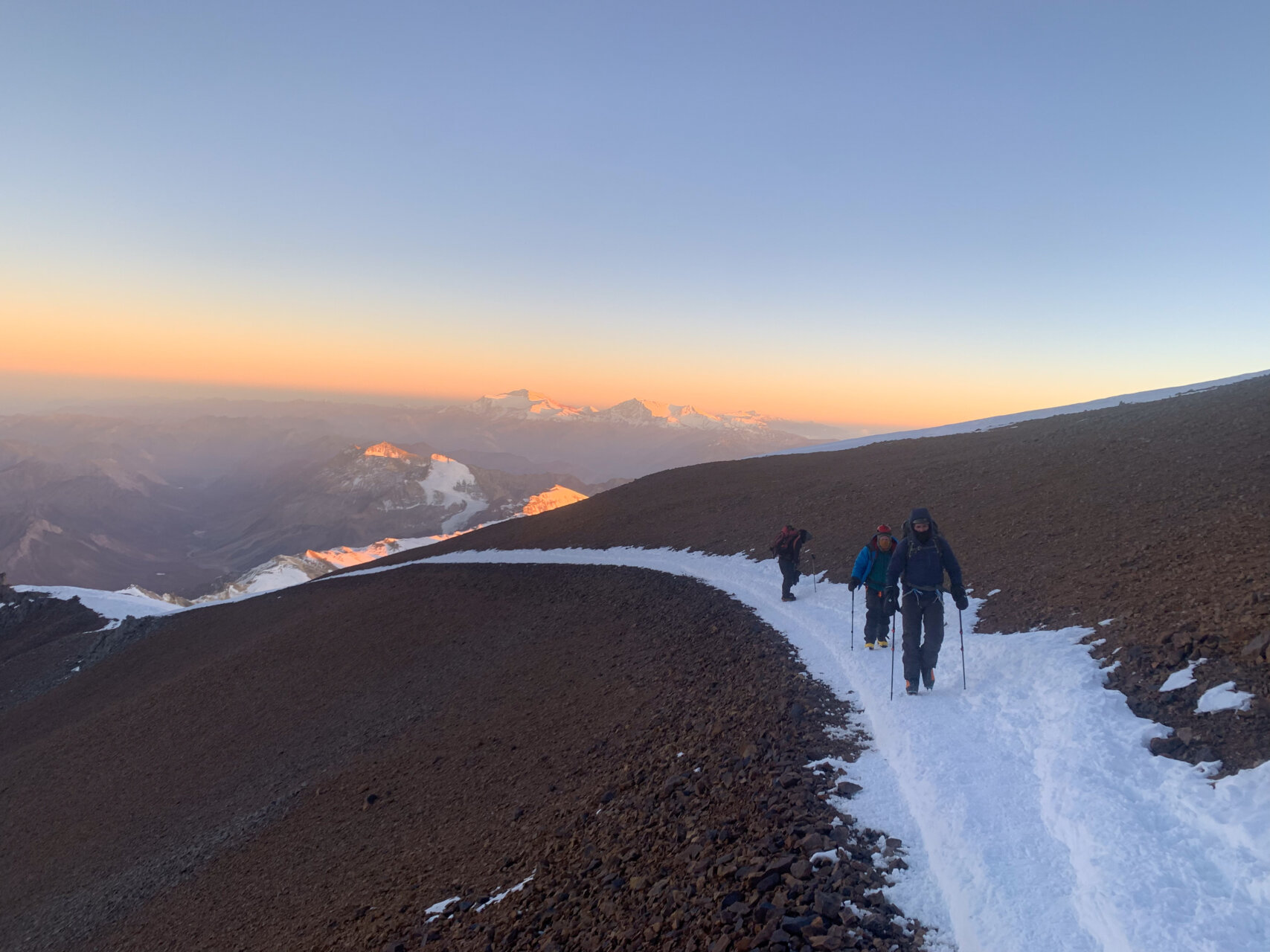Two mountaineers climbing up Aconcagua