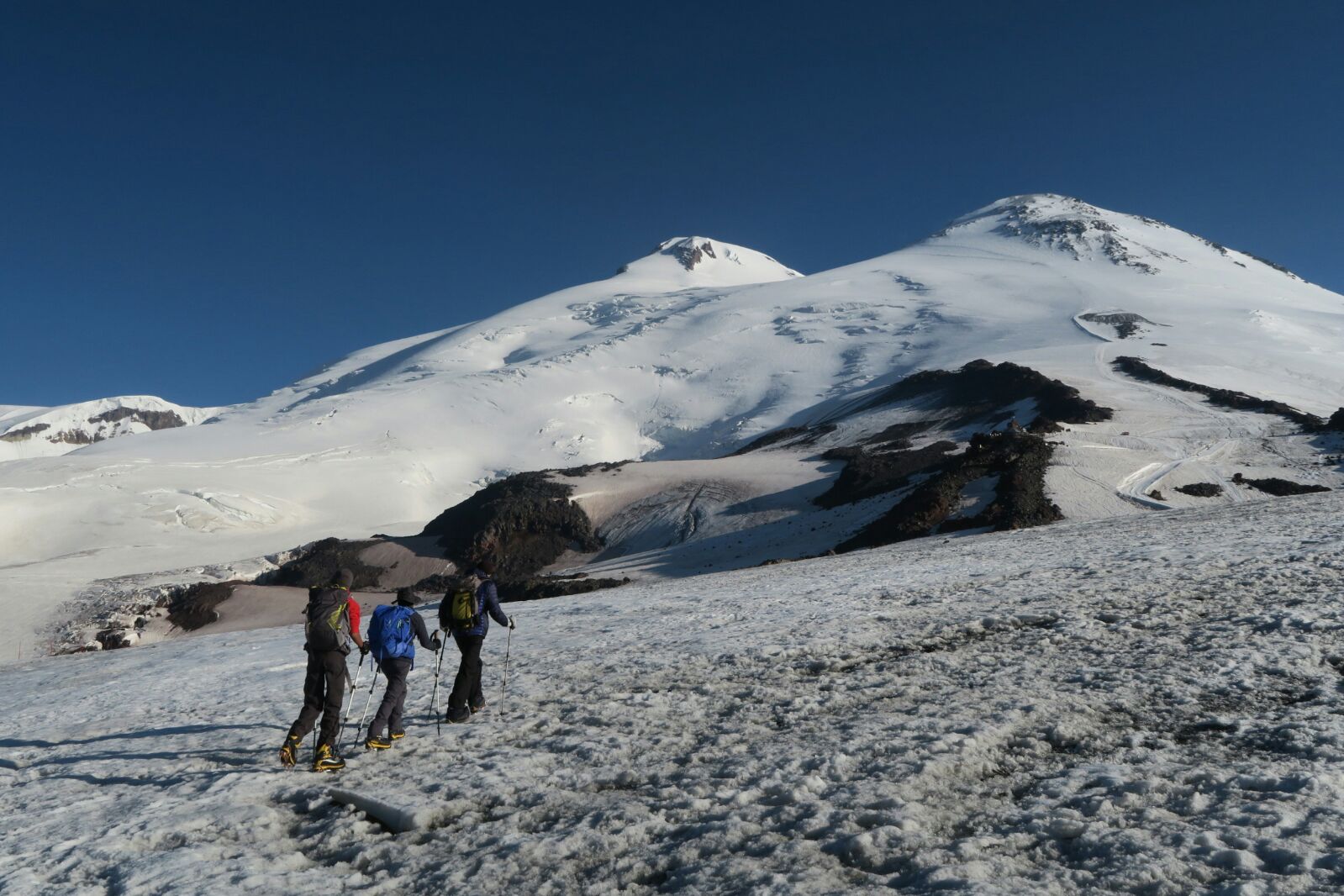 A group of clients hiking up Mount Elbrus during a guided Expedition