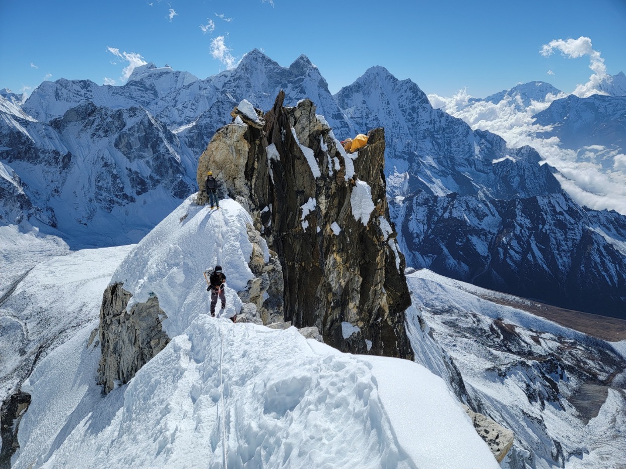Clients climbing up the ridge to Camp 3 on a guided Ama Dablam Expedition