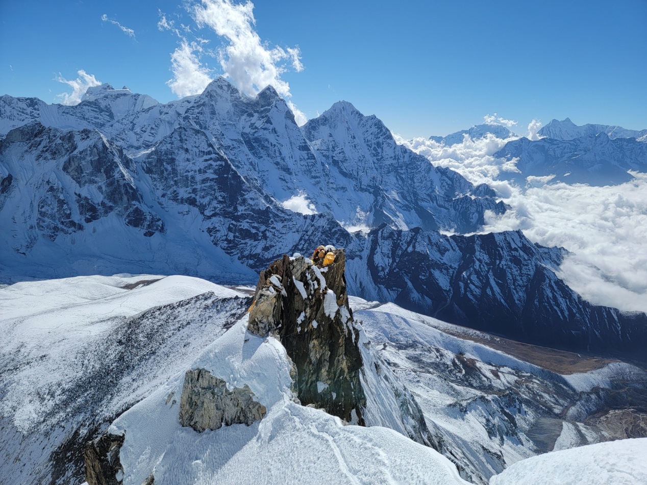 Ama Dablam Expedition clients climbing a ridge to Camp 3 on Ama Dablam