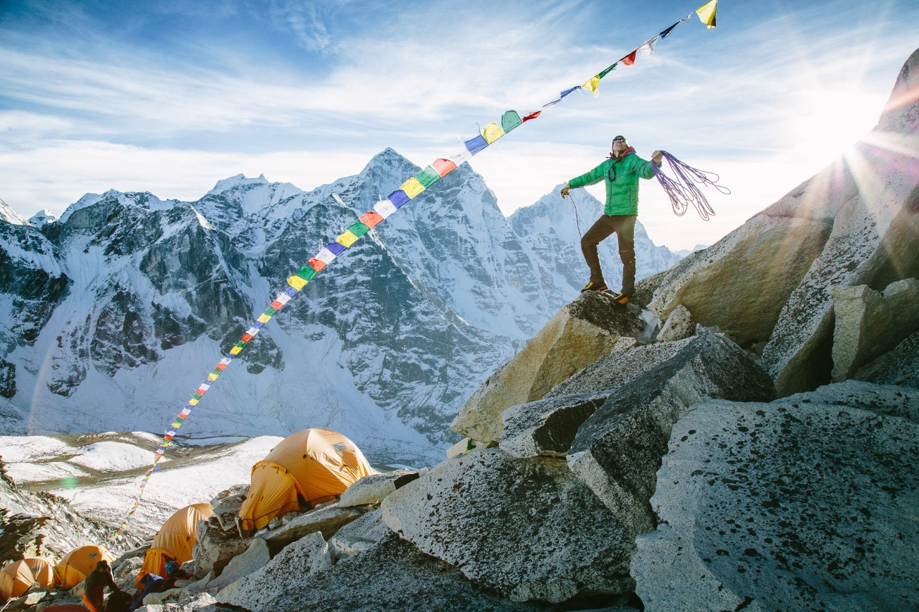 Adrian Ballinger coiling a rope at a high camp on Ama Dablam