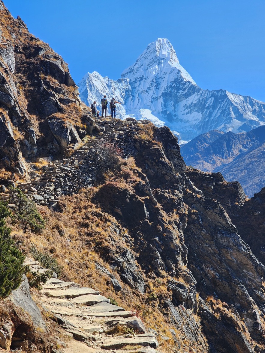 Ama Dablam Expedition clients hiking with Ama Dablam in the background
