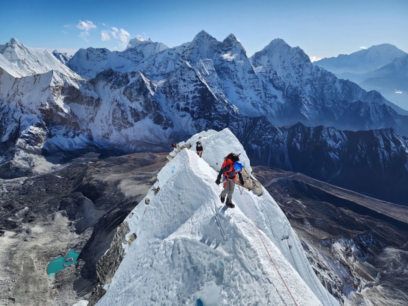 Ama Dablam Expedition clients climbing a ridge on Ama Dablam