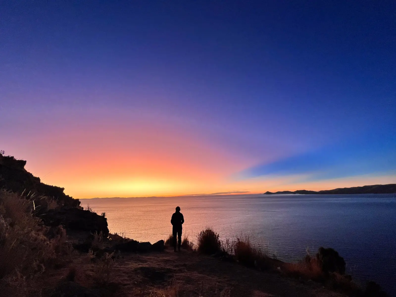 Sun setting over a lake during a guided Bolivia Expedition