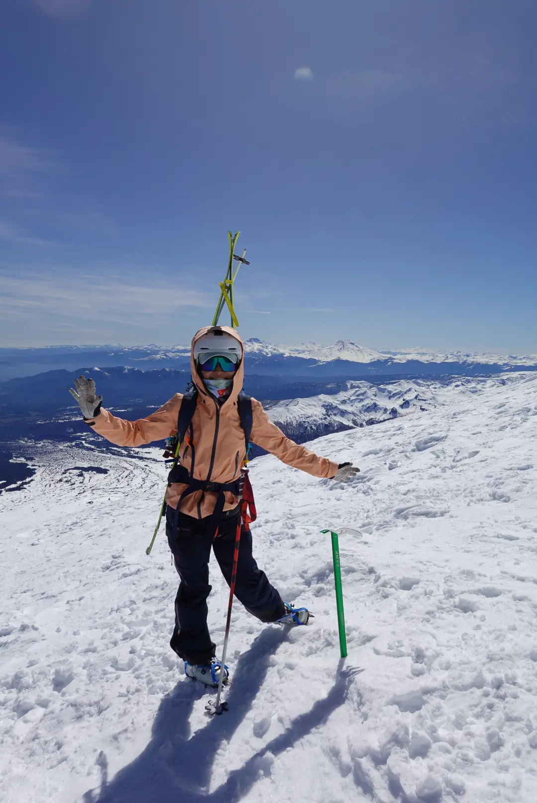 Ski mountaineer on the summit of a 6,000m peak in Chile with Alpenglow Expeditions' professionally guided ski mountaineering trip to Chile.
