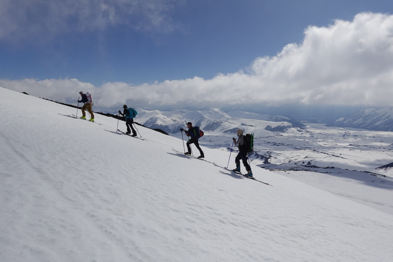 Group of ski mountaineers on the slope of a 6,000m peak in Chile with Alpenglow Expeditions' professionally guided ski mountaineering trip to Chile.