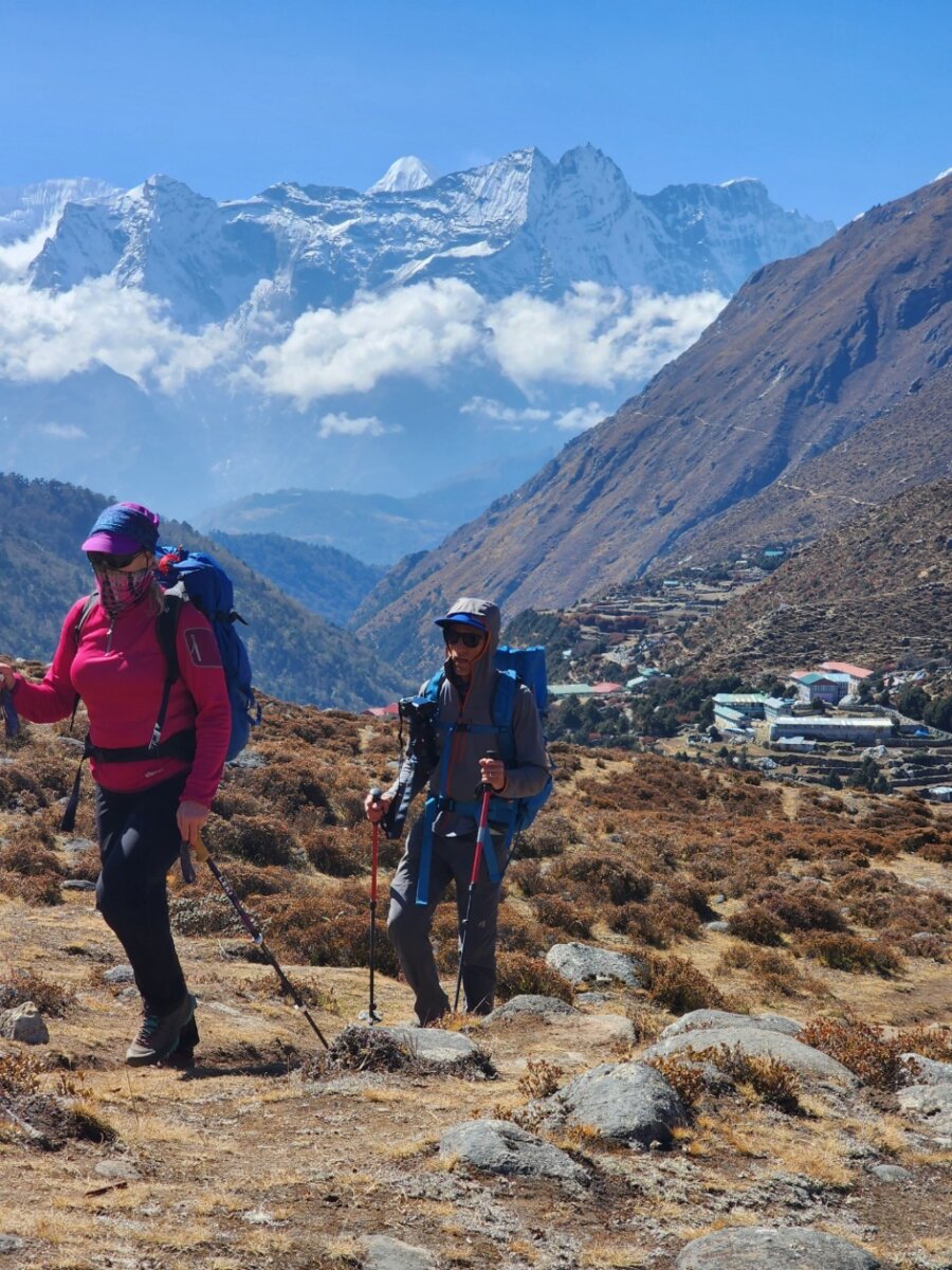 Hikers during the Everest Base Camp Trek with the Himalayas in the background.