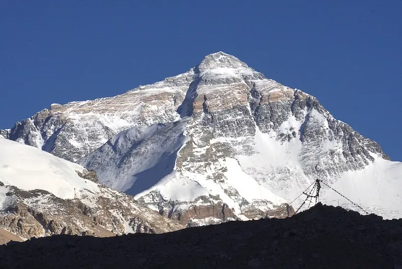 The approach to Everest Base Camp in Tibet with the Himalayas rising in the background during an Alpenglow Expeditions guided Everest trek