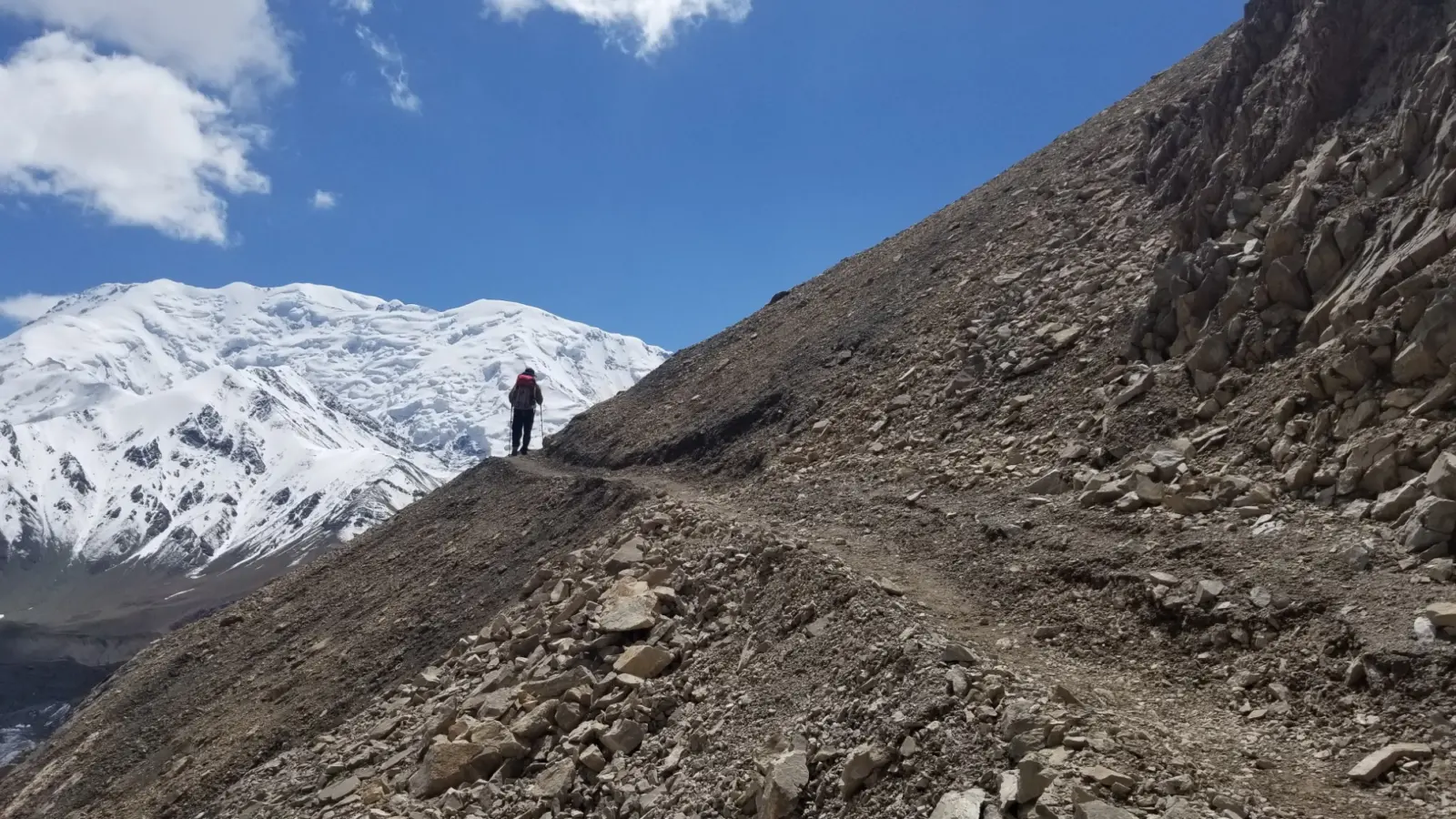 Client on an acclimatization hike during a guided Peak Lenin Expedition with Alpenglow Expeditions.