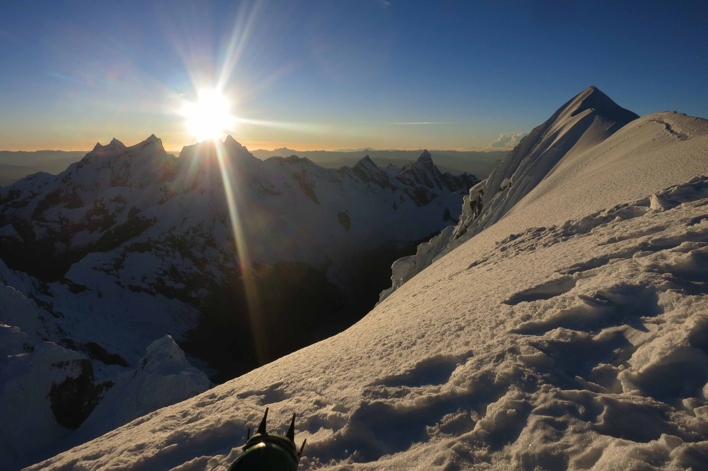 The sun rising over the Cordillera Blanca during a Pisco and Chopicalqui Expedition