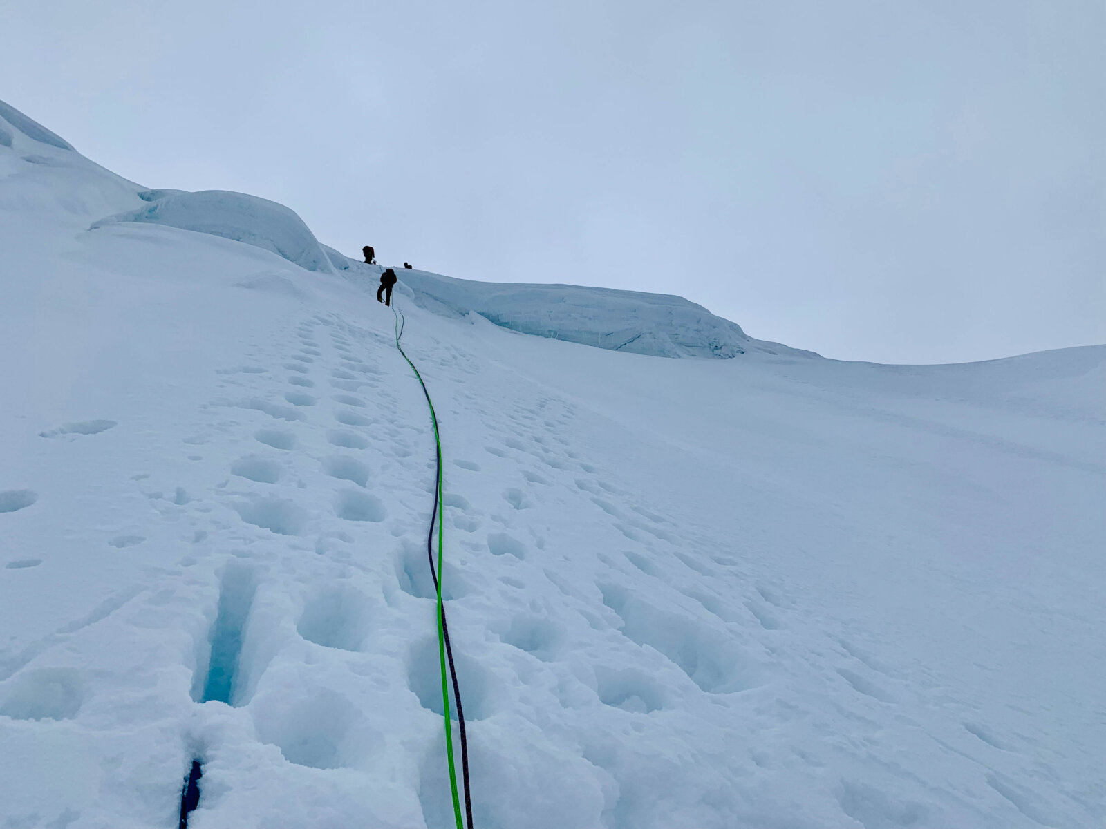 Student climbing a glaciated route during Alpenglow Expeditions'Peru Climbing School