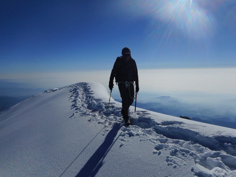 Alpenglow Expeditions climbers ascending a snow-capped Mexican volcano on the guided Volcanoes of Mexico expedition