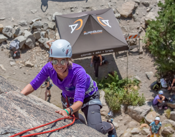 A woman climbing during a Guided Intro to Rock climbing course in Lake Tahoe with professional mountain guides