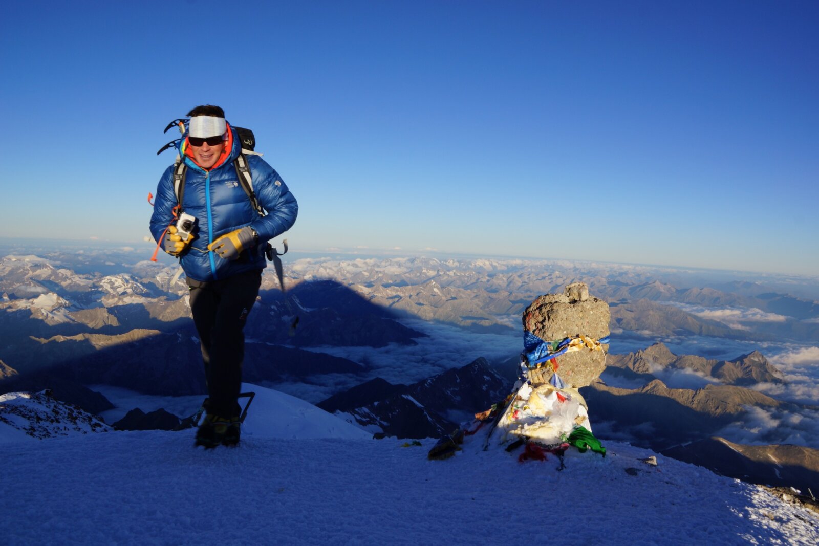 Client on the summit of Mount Elbrus during a guided Mount Elbrus Expedition