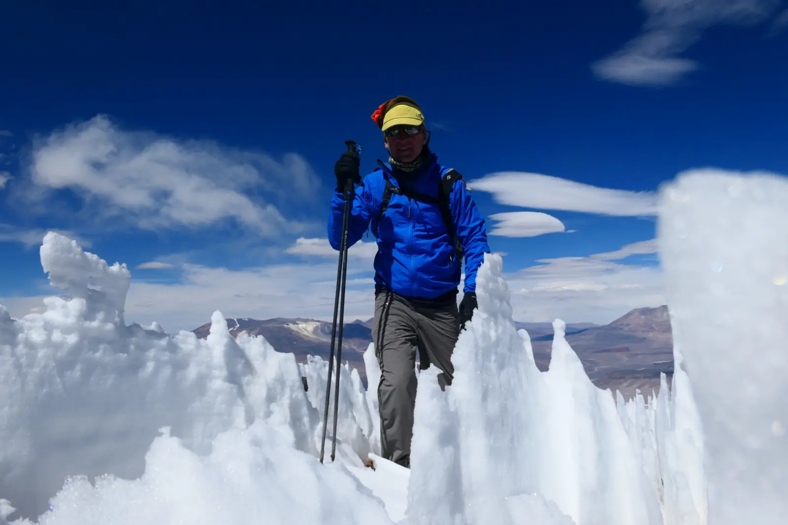 Client hiking through penitentes during a guided Ojos Del Salados Expedition