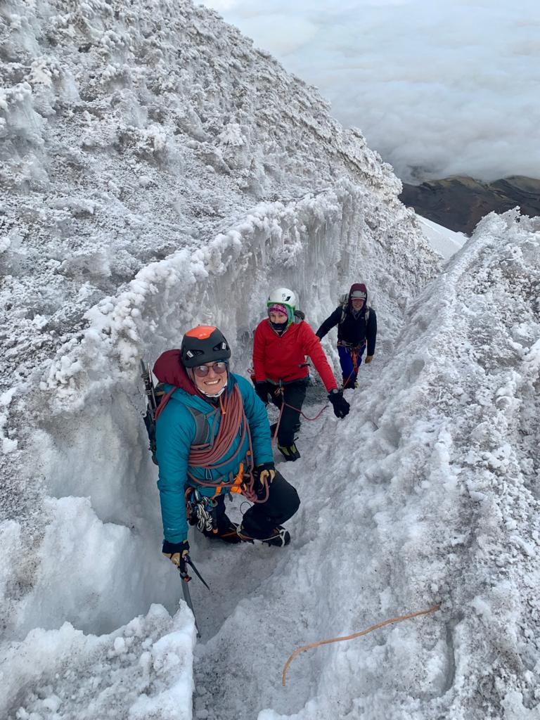 Female climbers standing on the slope of an Ecuadorian volcano during Alpenglow Expeditions' Women's Ecuador Climbing School.