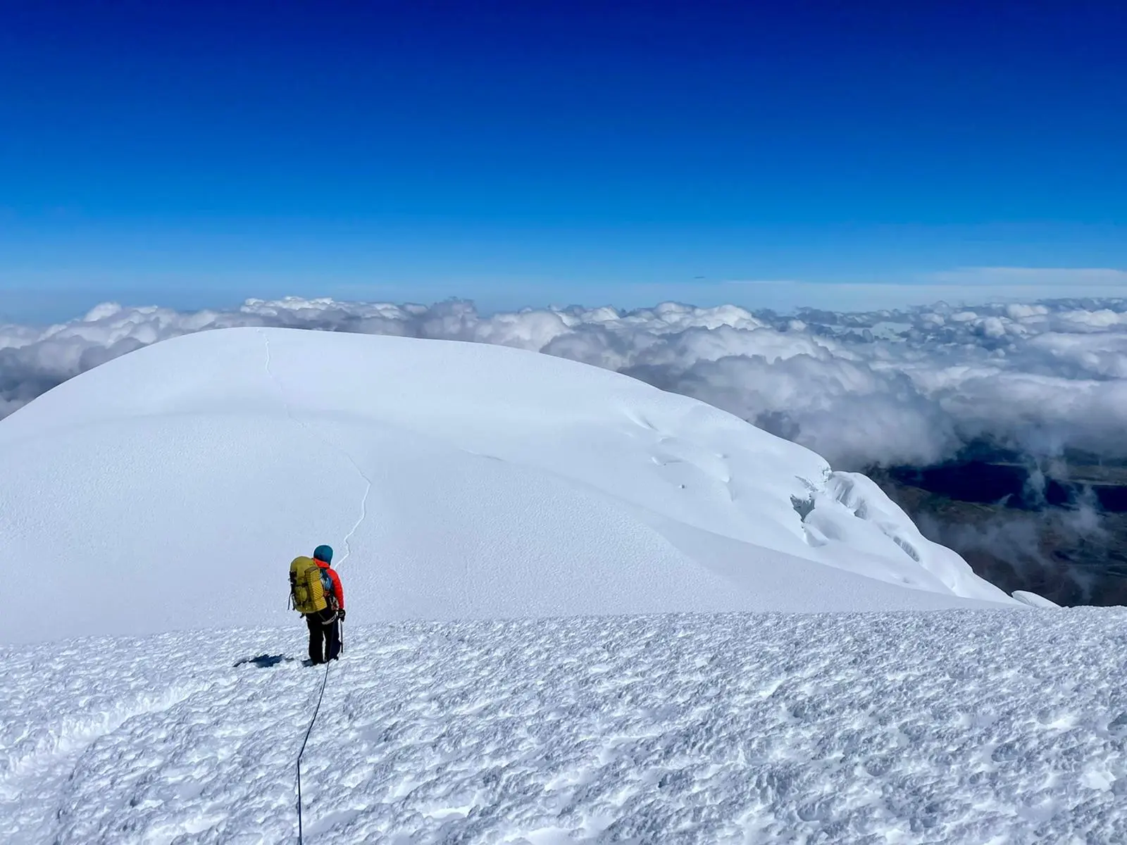 Female climber standing on the slope of an Ecuadorian volcano during Alpenglow Expeditions' Women's Ecuador Climbing School.