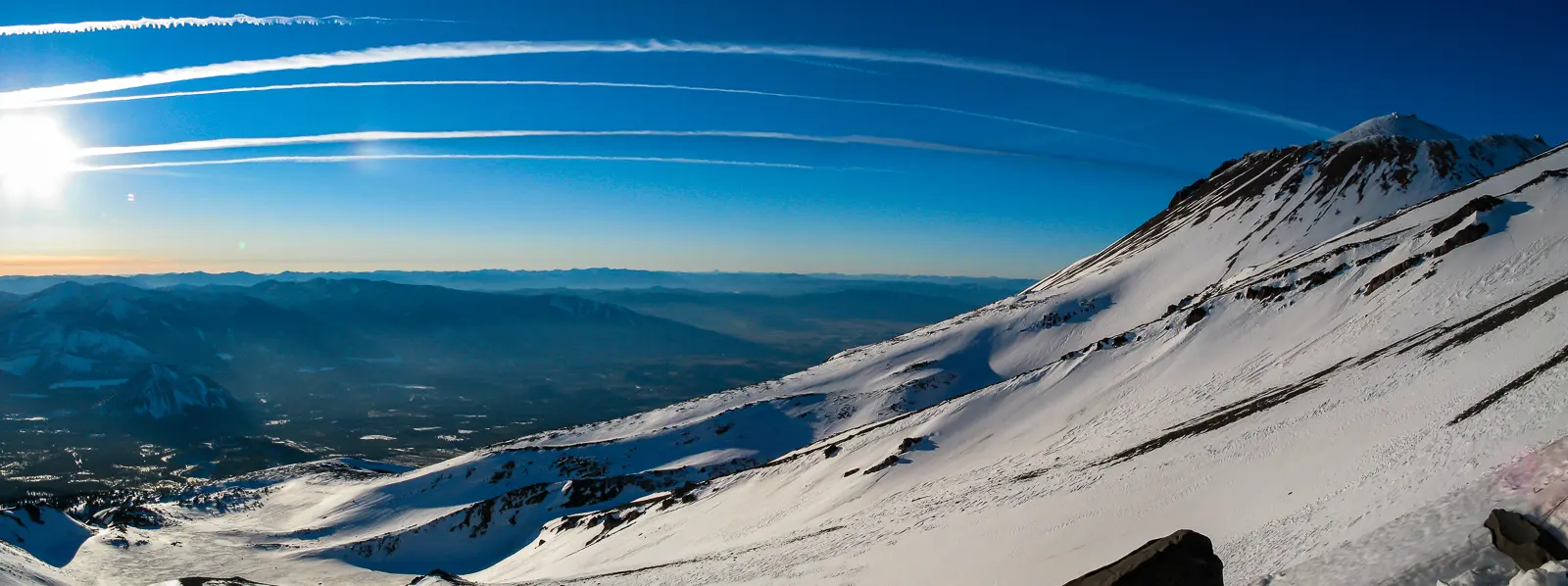 A panoramic view from the slopes of Mount Shasta. Learn mountaineering basics on Mount Shasta with Alpenglow Expeditions professional mountain guides