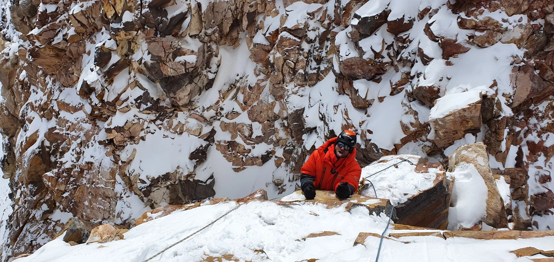 Mountaineer climbing up to the summit of Ojos Del Salados during a guided Expedition