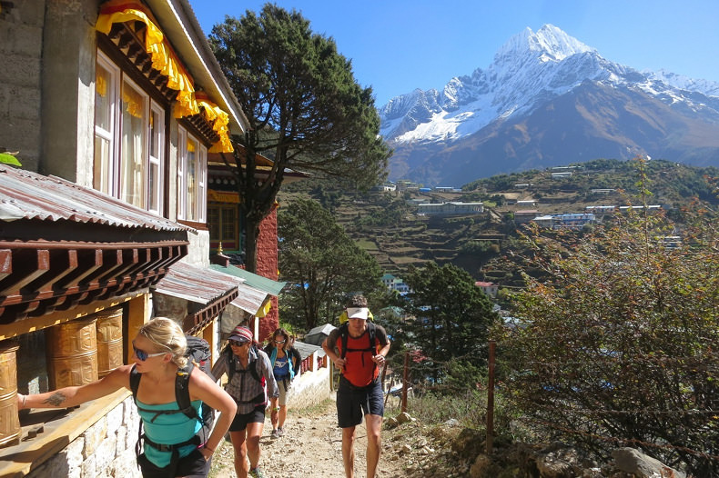Emily Harrington touching prayer wheels in Nepal during the Everest Base Camp Trek with Alpenglow Expeditions