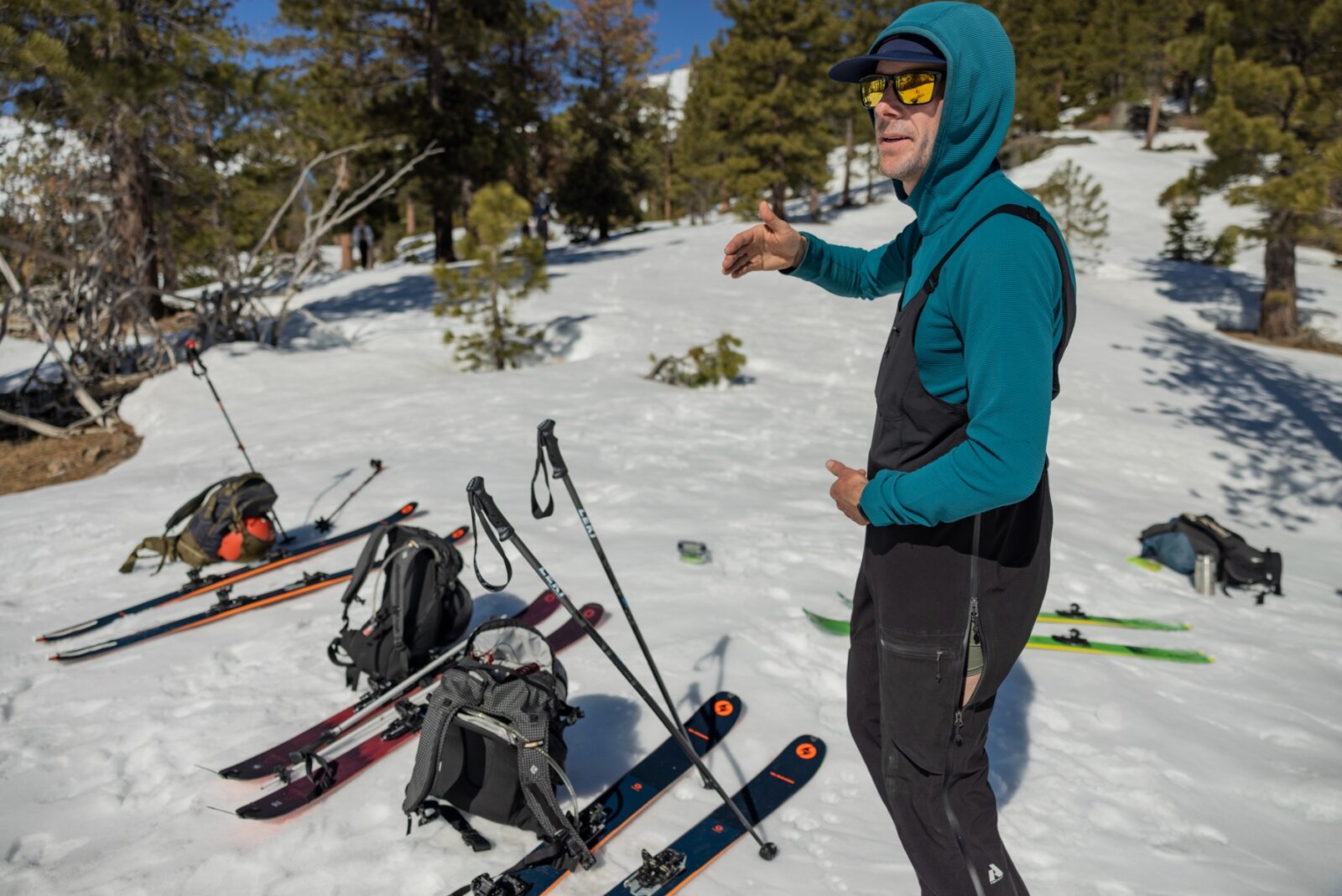 Guide explains backcountry touring principles during an Intro to Backcountry Skiing and Splitboarding course in Lake Tahoe with professional ski guides.
