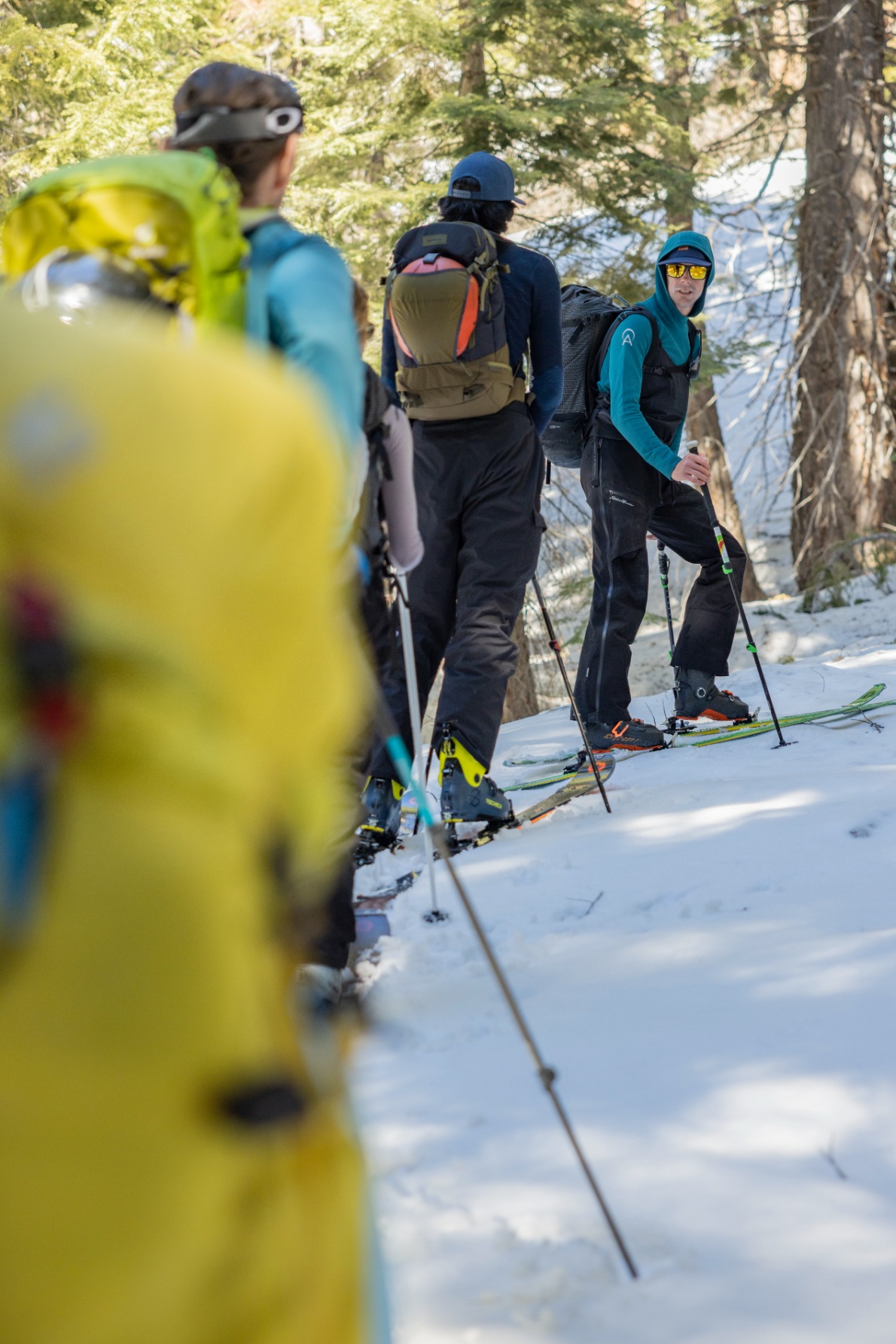 A professional ski guide leads a group of backcountry skiers on an intro to backcountry course in Lake Tahoe