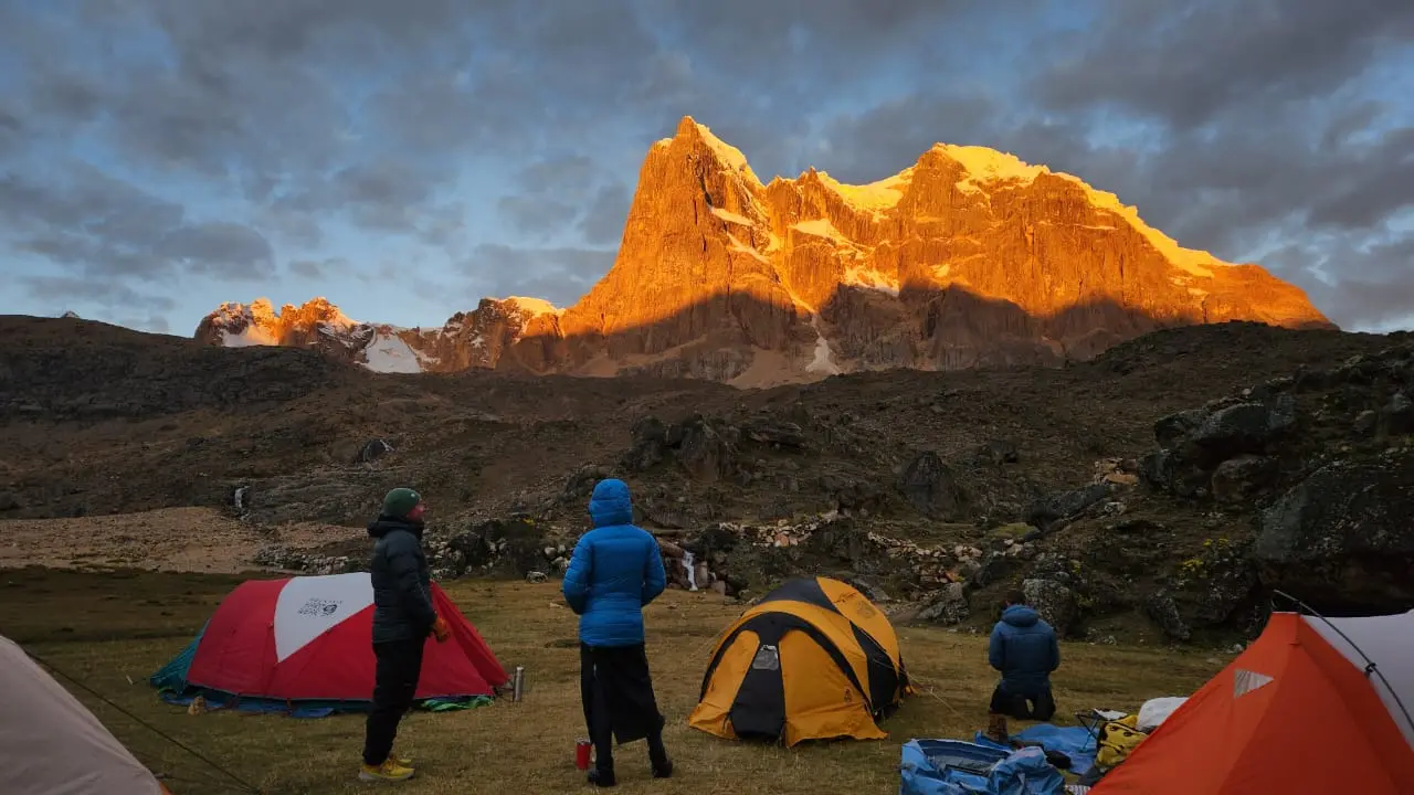 Sun rising over a camp on the Cordillera Huayhuash Trek