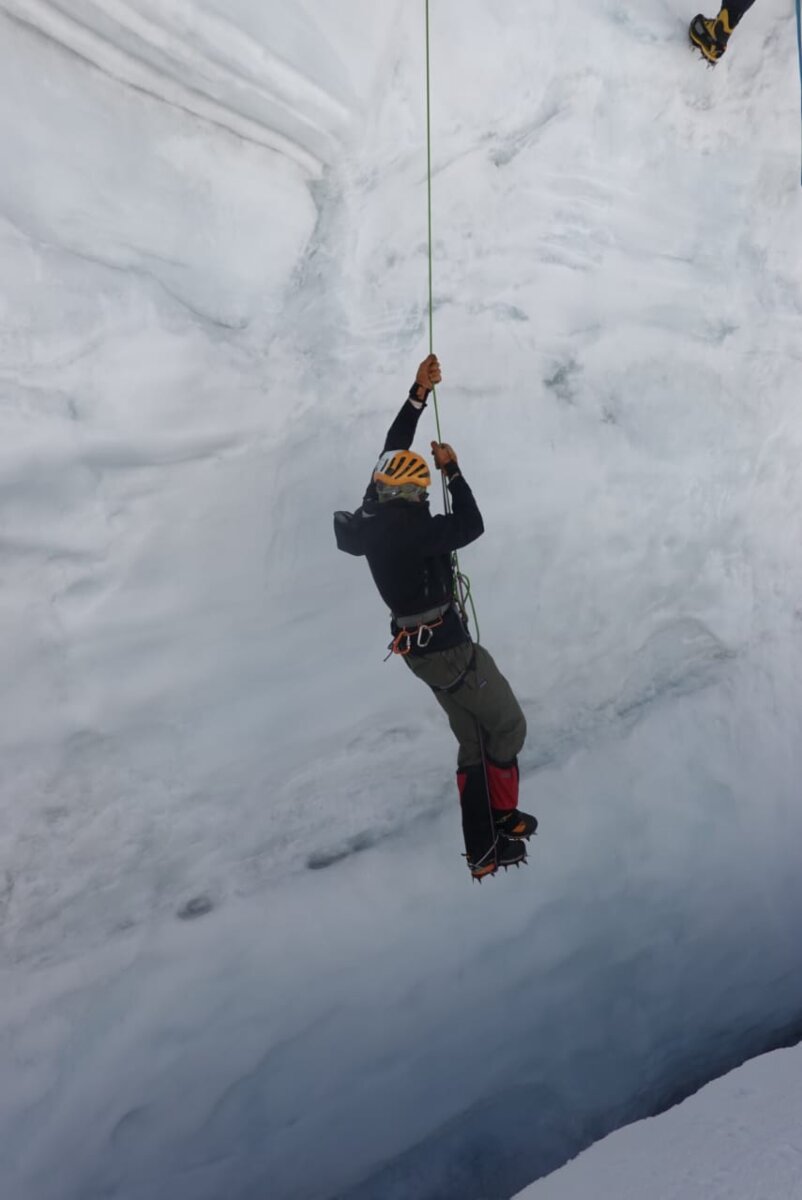 A climber practicing rope skills on a glacier during Alpenglow Expeditions' Peru Climbing School