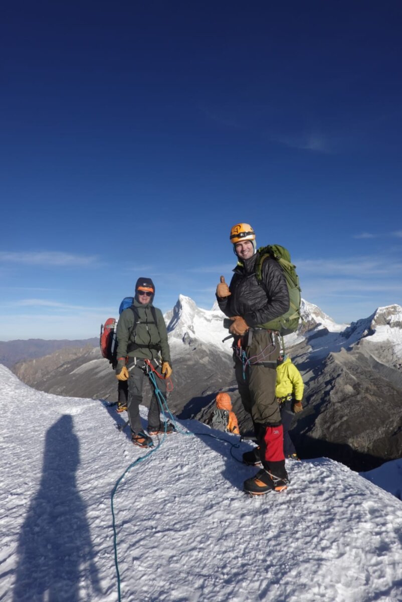 Two mountaineers on the summit of Chopicalqui