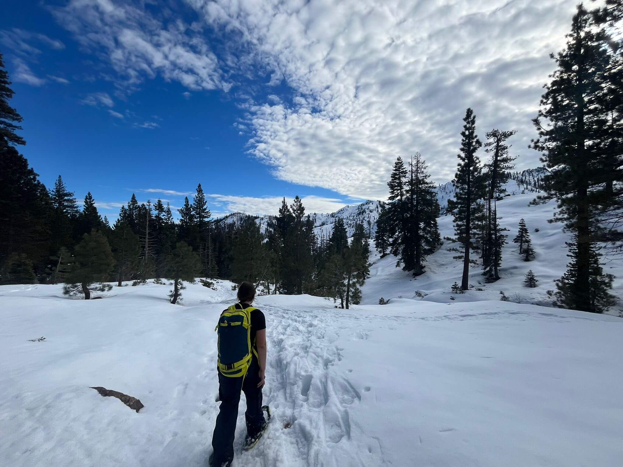 A client on a guided snowshoe tour in Lake Tahoe with Alpenglow Expeditions.