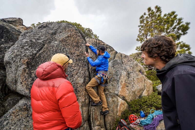 Rock climbing guide teaching a gear placement course in Lake Tahoe.