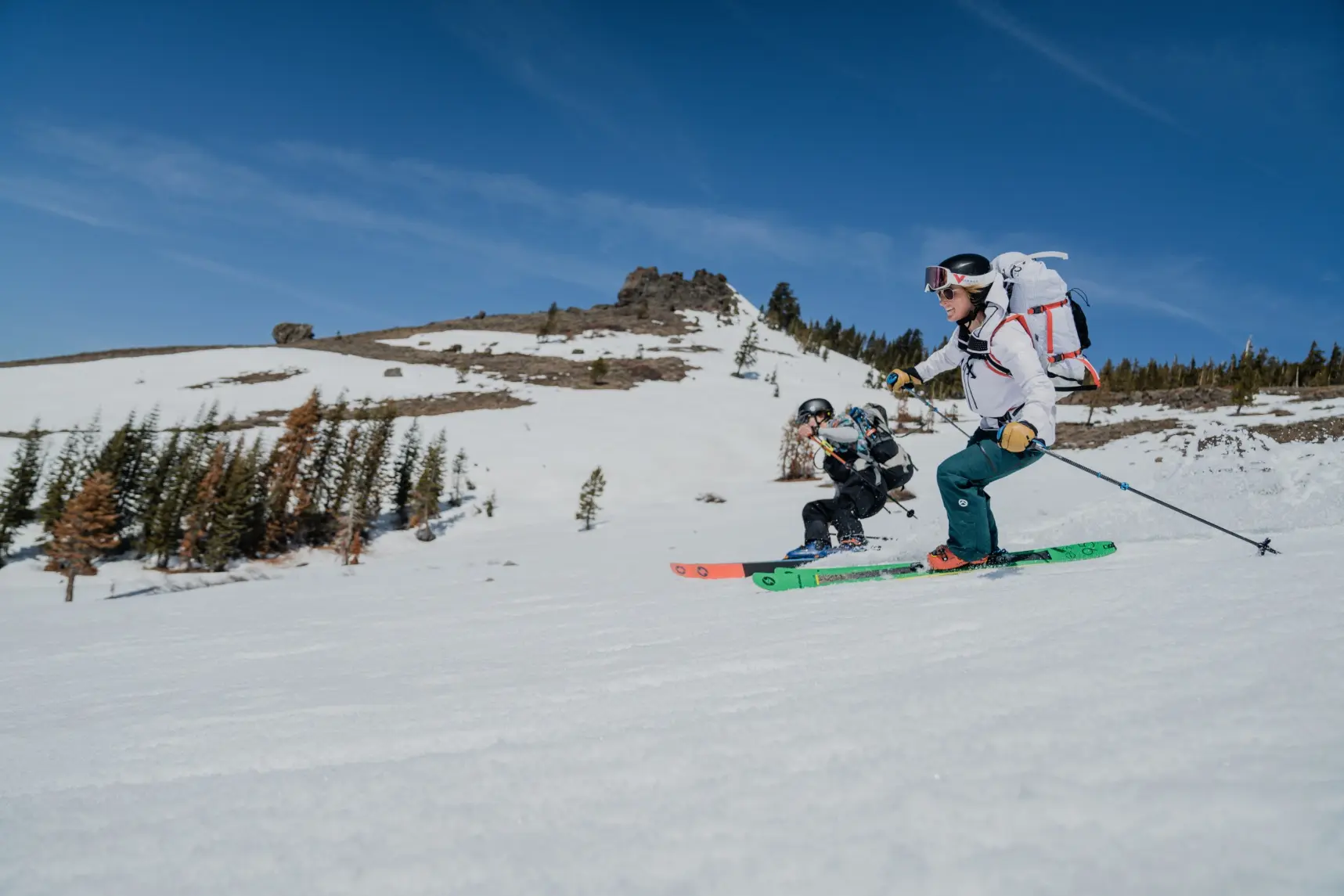 Clients skiing down during a private backcountry ski guiding in lake tahoe with professional mountain guides
