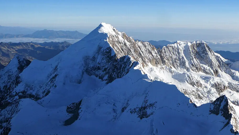 The white summit pyramid of Illampu. 
