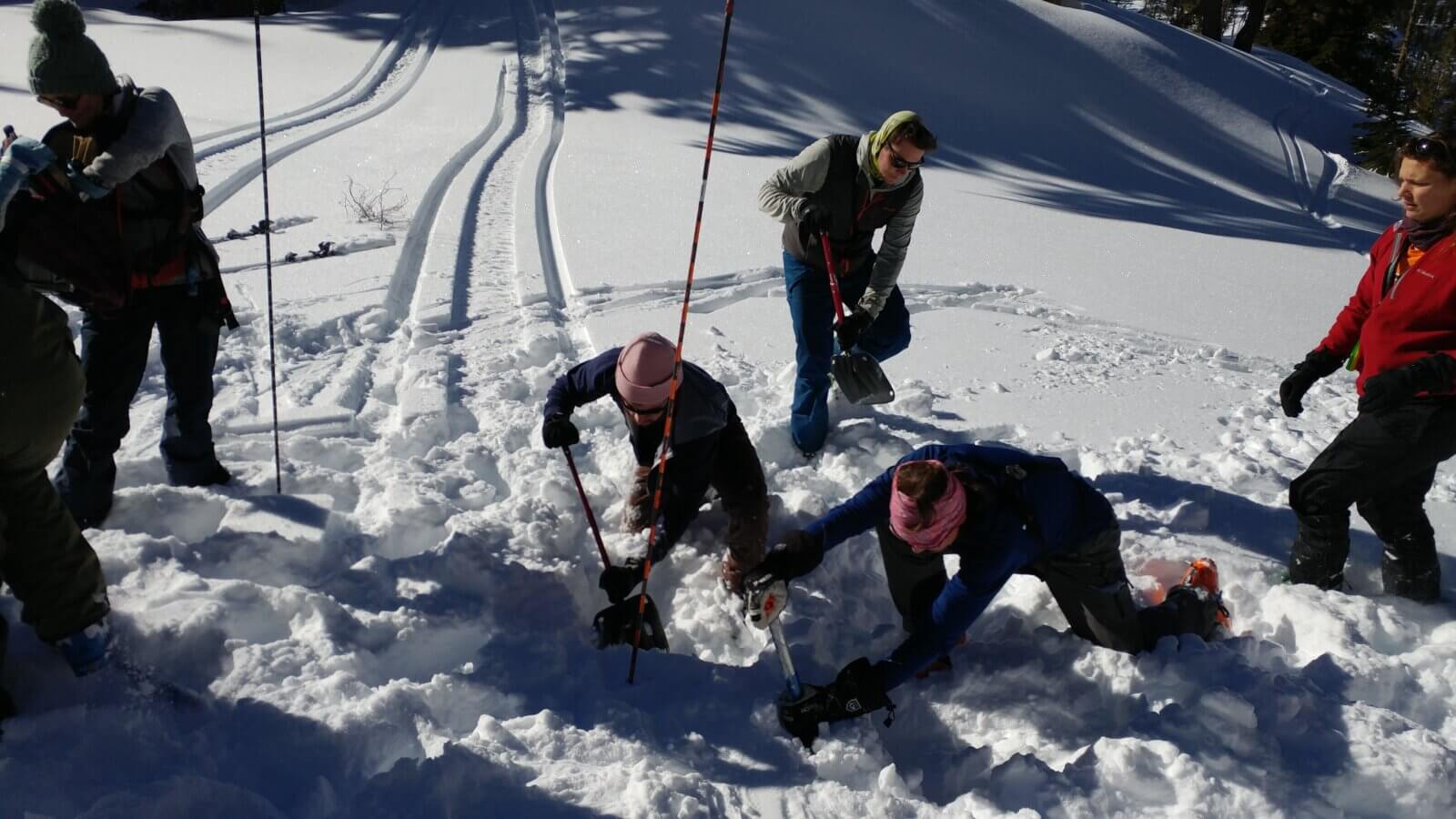 A group practicing avalanche rescue skills in Lake Tahoe