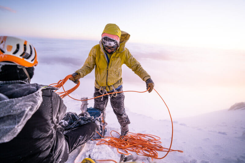 Esteban 'Topo' Mena coiling a rope while guiding a Cotopaxi Expedition with Alpenglow Expeditions.