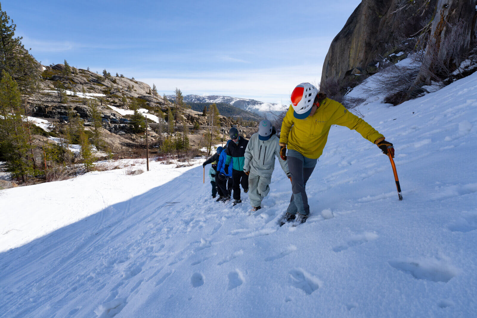 Climbers practice walking with crampons during an intro to mountaineering course in tahoe