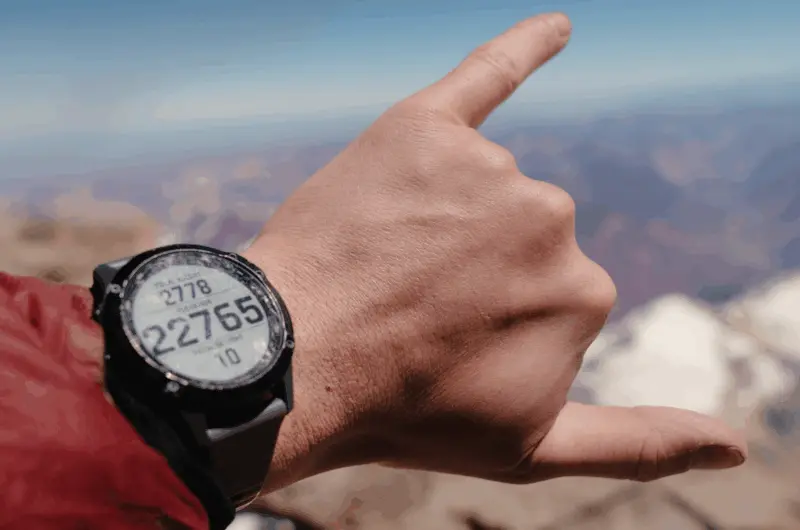 A mountaineer tracking the climb on a high-altitude guided climbing expedition